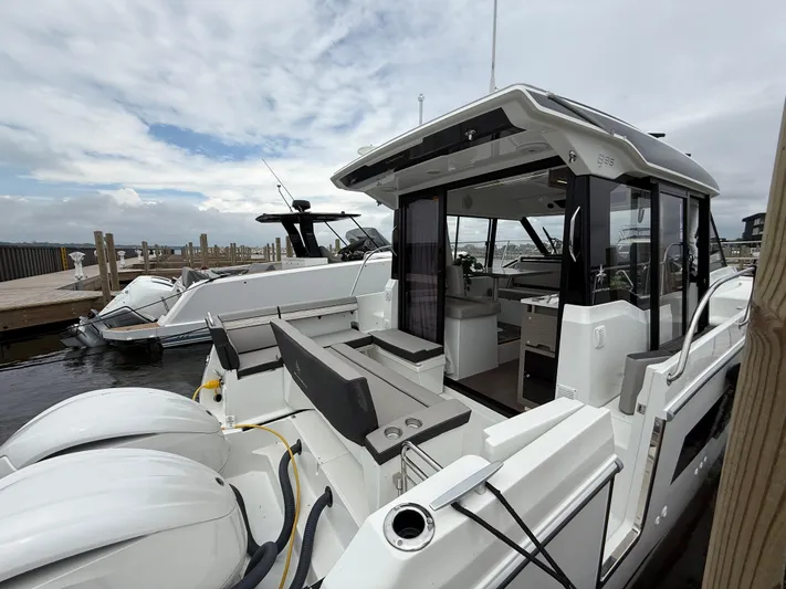  Yacht Photos Pics 2024 Jeanneau NC Weekender 895 Series 2 docked, showcasing sleek design and spacious interior.