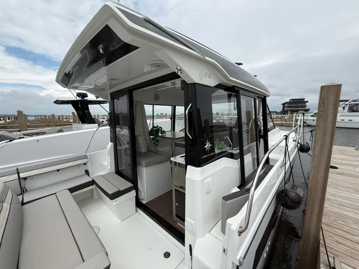  Yacht Photos Pics 2024 Jeanneau NC Weekender 895 Series 2 docked, showcasing sleek design and spacious interior.