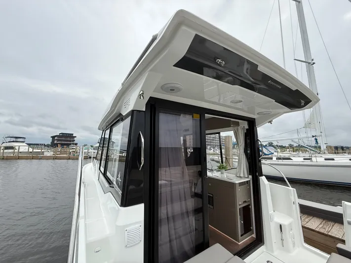  Yacht Photos Pics 2024 Jeanneau NC Weekender 895 Series 2 docked, showcasing sleek design and modern amenities.