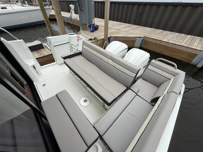  Yacht Photos Pics 2024 Jeanneau NC Weekender 895 Series 2 boat with spacious seating and twin outboard engines.