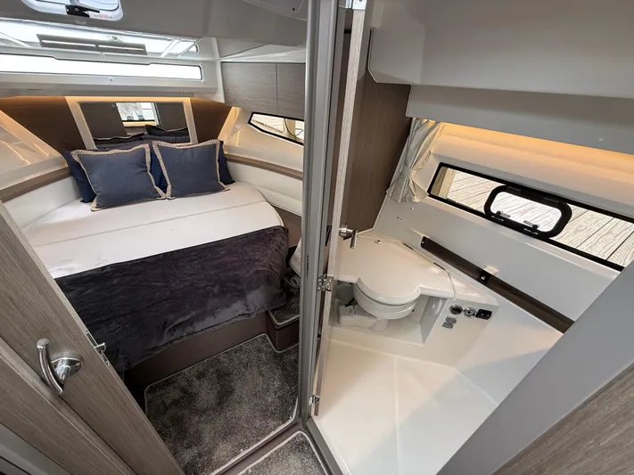  Yacht Photos Pics 2024 Jeanneau NC Weekender 895 Series 2 cabin with bed and compact bathroom.