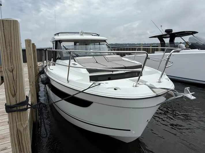  Yacht Photos Pics 2024 Jeanneau NC Weekender 895 Series 2 docked, showcasing sleek design and modern features.