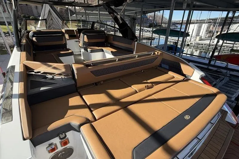 Luxurious 2025 Cobalt R35 boat interior with tan leather seating and modern design.