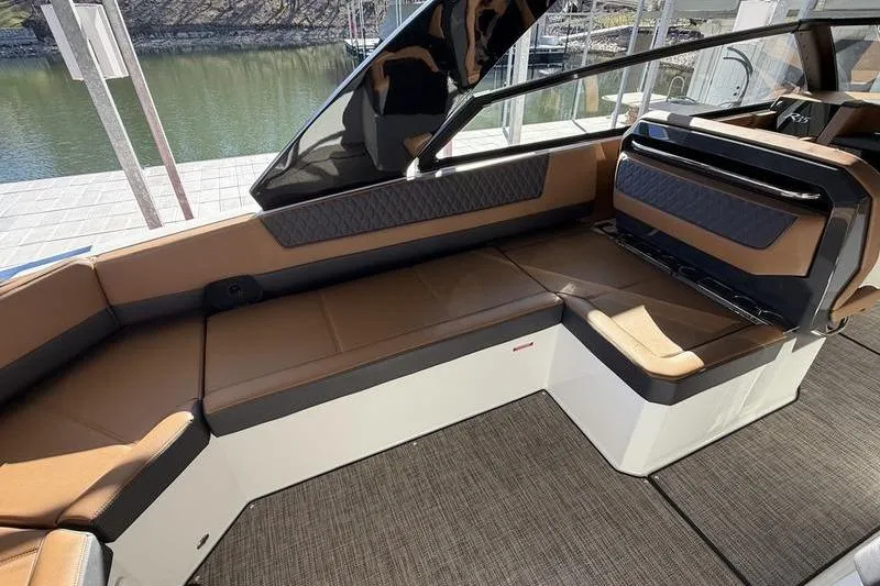 Luxurious interior of 2025 Cobalt R35 boat with brown seating and modern design.
