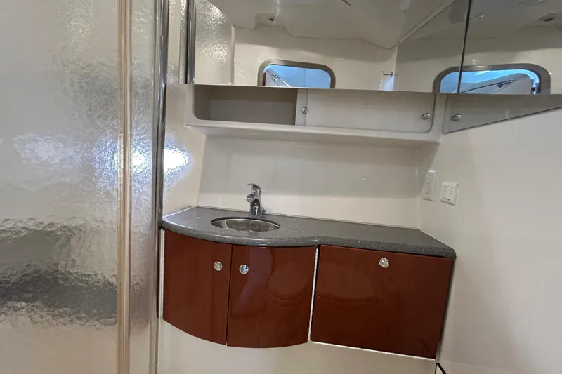  Yacht Photos Pics 2005 Formula 40 Performance Cruiser bathroom with sleek sink and wooden cabinetry.