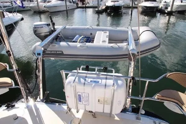 Patience Yacht Photos Pics Hylas 46 yacht with inflatable dinghy and Honda motor, docked in marina, 2012 model.