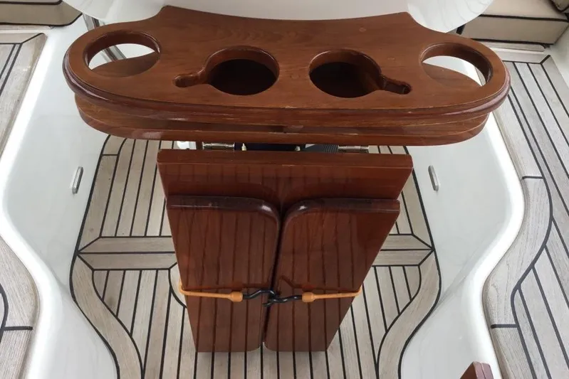 Patience Yacht Photos Pics Wooden cup holder and table on 2012 Hylas 46 yacht deck.