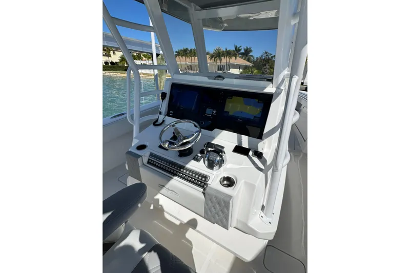 Reel Advice Yacht Photos Pics 2019 Invincible 39 Open Fisherman boat console with steering wheel and navigation screens.