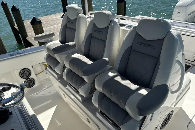 Reel Advice Yacht Photos Pics 2019 Invincible 39 Open Fisherman boat with luxurious seating and ocean backdrop.