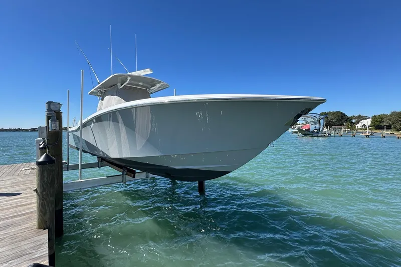 Reel Advice Yacht Photos Pics 2019 Invincible 39 Open Fisherman boat docked on clear blue water.