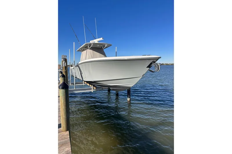 Reel Advice Yacht Photos Pics 2019 Invincible 39 Open Fisherman boat docked above water.