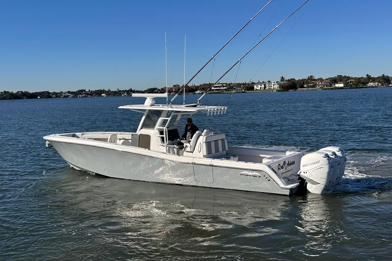 Reel Advice Yacht Photos Pics 2019 Invincible 39 Open Fisherman boat cruising on calm waters.