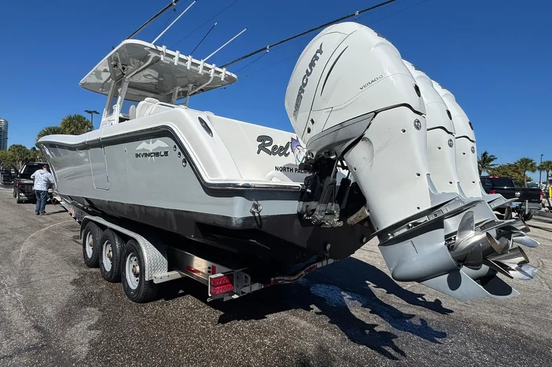 Reel Advice Yacht Photos Pics 2019 Invincible 39 Open Fisherman boat with triple Mercury engines on a trailer.