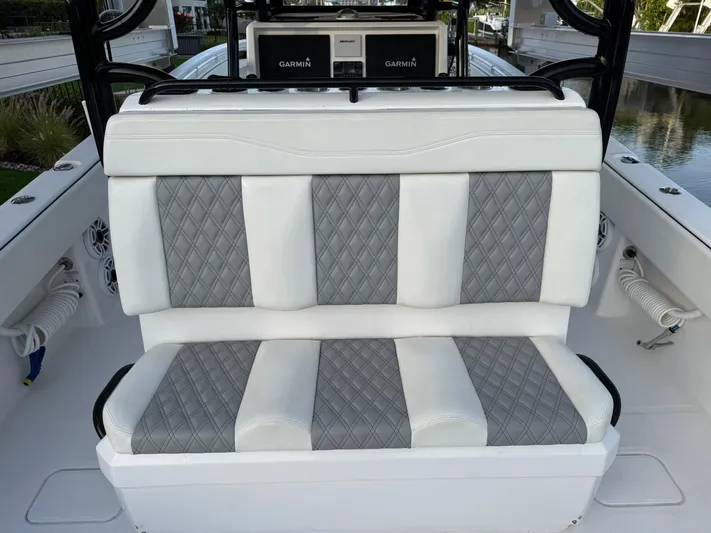  Yacht Photos Pics 2023 Invincible 33 Catamaran interior with diamond-stitched seating and Garmin electronics.