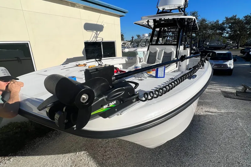  Yacht Photos Pics 2023 Invincible 33 Catamaran with advanced trolling motor, docked outdoors.