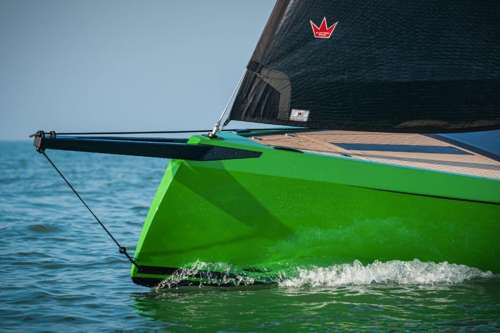 Saffier 24 Lite 2026 sailboat with vibrant green hull on the water.