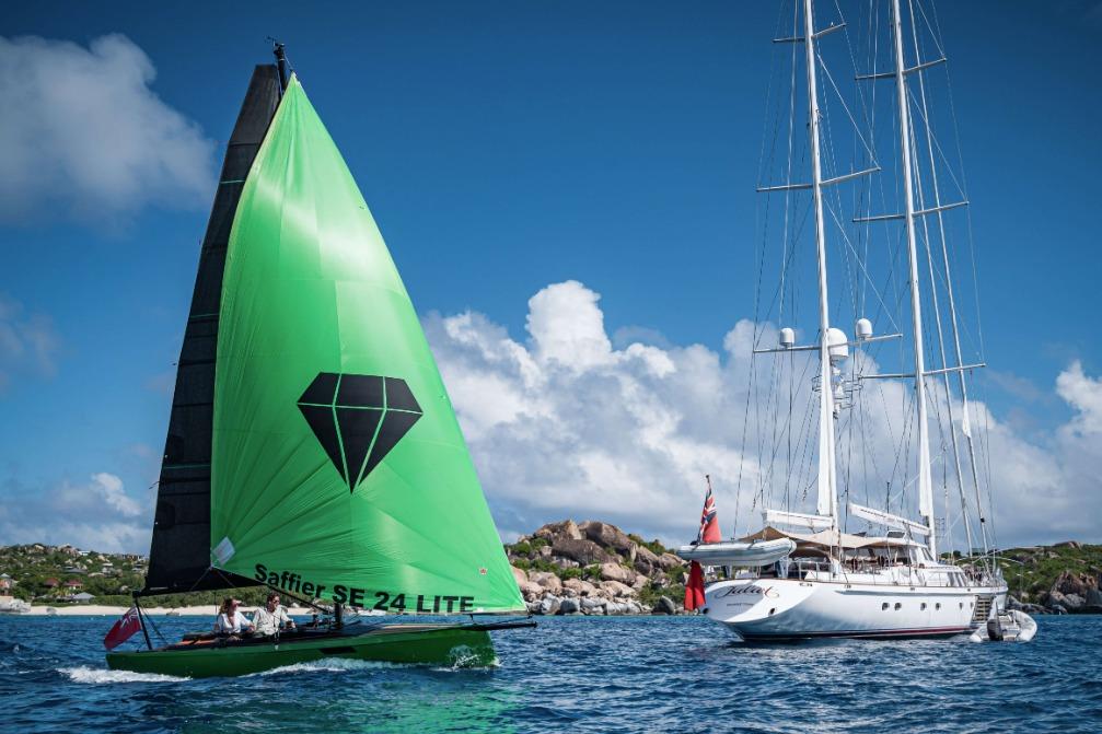 Saffier 24 Lite sailboat with green sail on blue ocean, 2026 model.