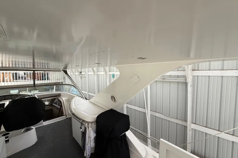  Yacht Photos Pics 1997 Bayliner 5788 Pilot House Motoryacht interior with helm and covered seating.