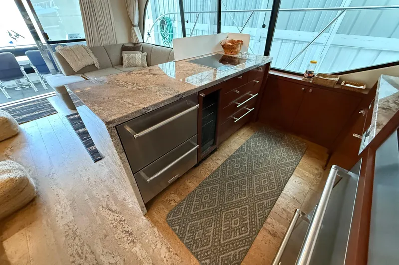  Yacht Photos Pics Luxurious kitchen interior of 1997 Bayliner 5788 Pilot House Motoryacht with granite countertops.