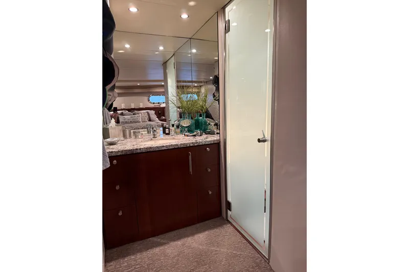  Yacht Photos Pics Luxurious interior of 1997 Bayliner 5788 Pilot House Motoryacht with elegant cabinetry and decor.