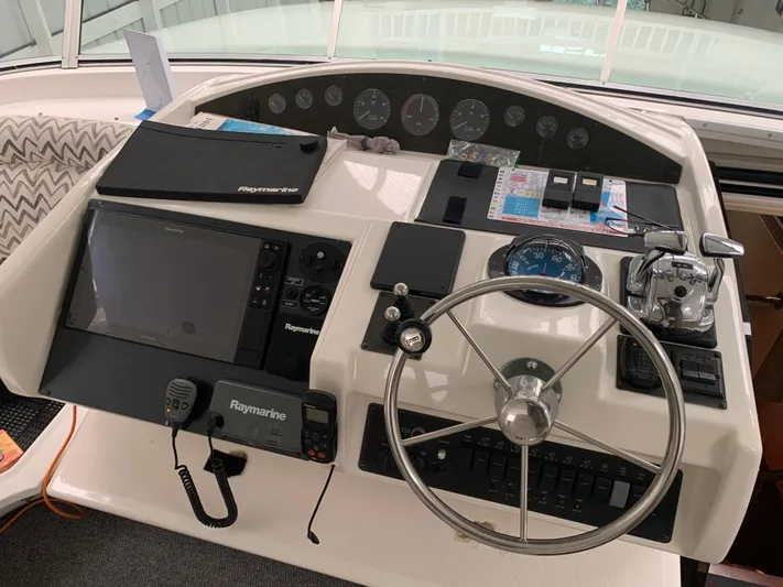  Yacht Photos Pics 1997 Bayliner Pilothouse helm with navigation equipment and steering wheel.
