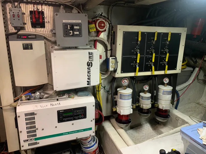  Yacht Photos Pics Engine room of a 1997 Bayliner Pilothouse with electrical panels and equipment.