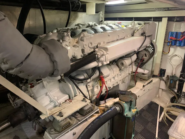  Yacht Photos Pics Engine room of a 1997 Bayliner Pilothouse boat, showcasing a large marine engine.