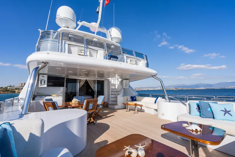 Stella Fiera Yacht Photos Pics Luxurious 1998 Benetti Classic yacht deck with elegant seating and ocean view.