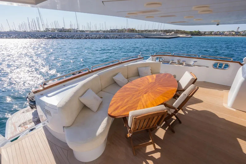 Stella Fiera Yacht Photos Pics Luxurious 1998 Benetti Classic yacht deck with elegant seating and ocean view.