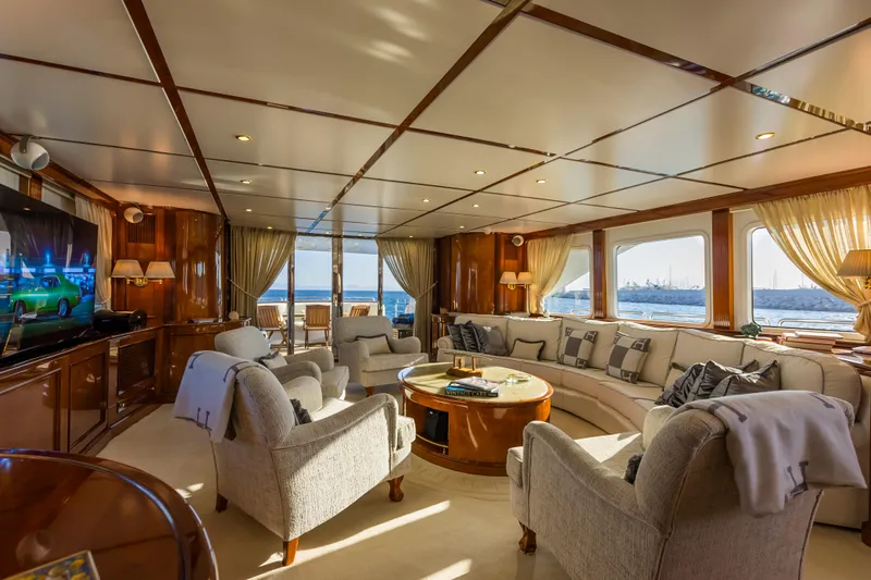 Stella Fiera Yacht Photos Pics Luxurious interior of 1998 Benetti Classic yacht with elegant seating and ocean views.