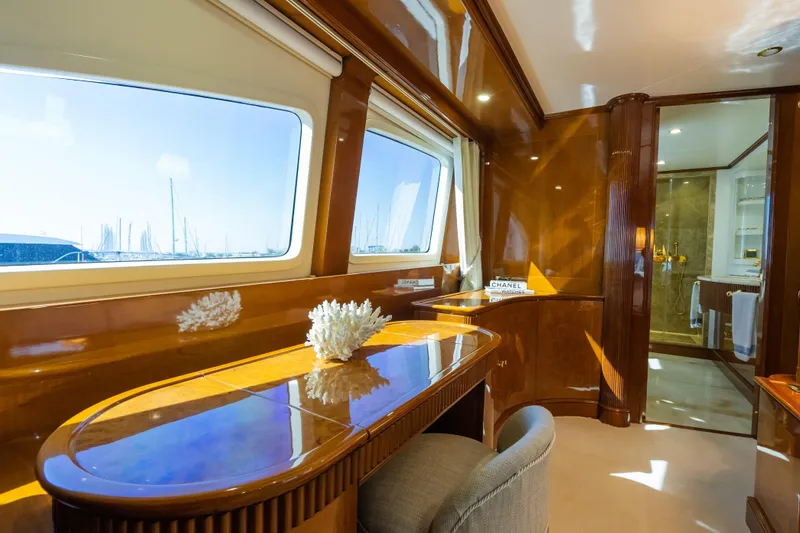 Stella Fiera Yacht Photos Pics Luxurious interior of 1998 Benetti Classic yacht with elegant wood finish and large windows.