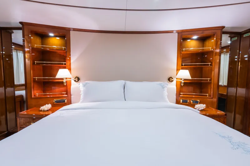 Stella Fiera Yacht Photos Pics Luxurious bedroom interior on 1998 Benetti Classic yacht with elegant wood finishes.