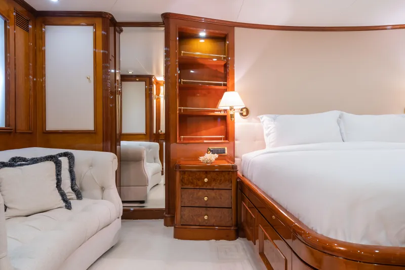 Stella Fiera Yacht Photos Pics Luxurious 1998 Benetti Classic yacht bedroom with elegant wood finishes and plush bedding.