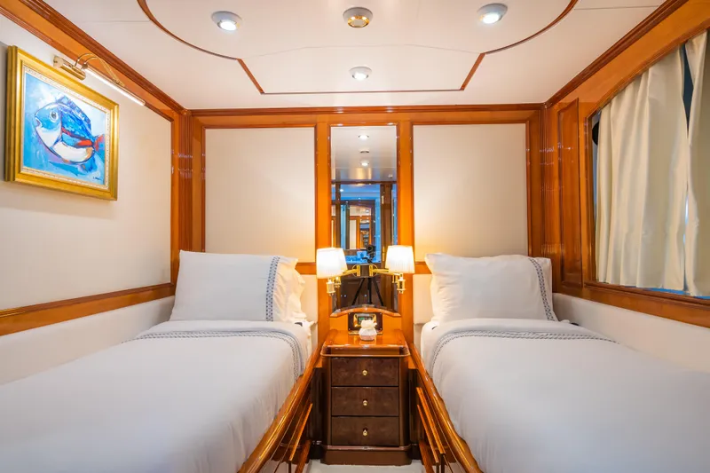 Stella Fiera Yacht Photos Pics Luxurious twin cabin on 1998 Benetti Classic yacht with elegant wood finishes and artwork.