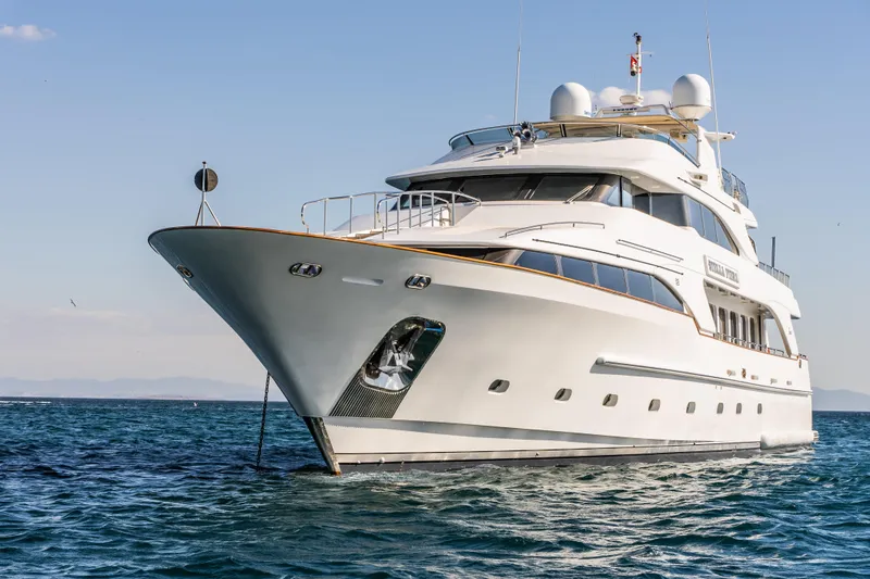 Stella Fiera Yacht Photos Pics Luxurious 1998 Benetti Classic yacht cruising on open water.