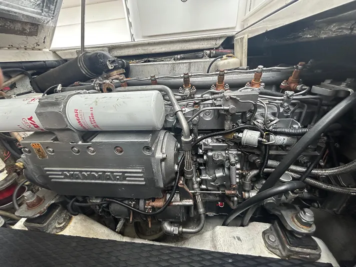  Yacht Photos Pics Engine compartment of a 2004 Stamas 370 Express boat, featuring a Yanmar engine.