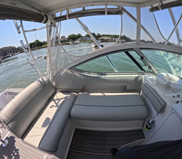  Yacht Photos Pics 2004 Stamas 370 Express boat interior with cushioned seating and waterfront view.