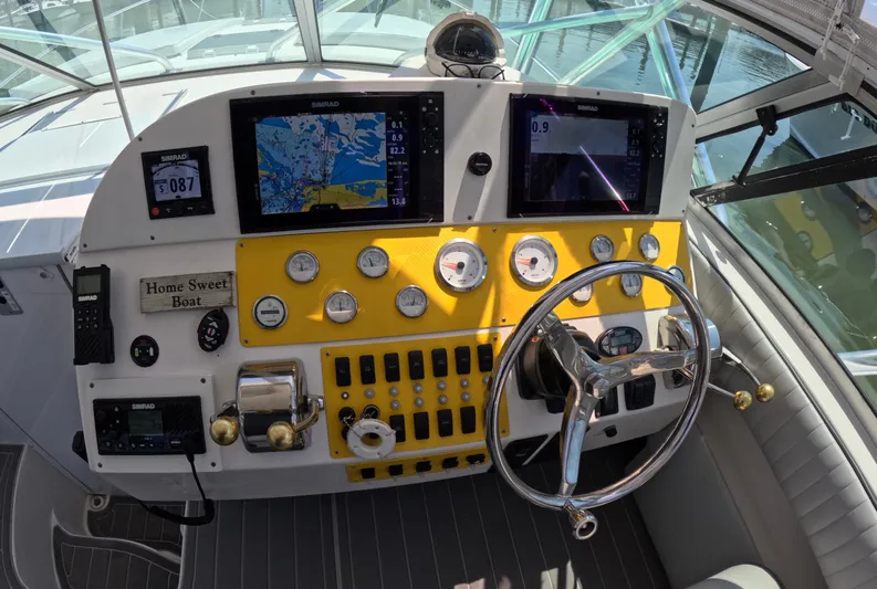  Yacht Photos Pics 2004 Stamas 370 Express boat helm with navigation screens and controls.