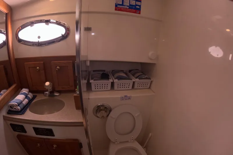  Yacht Photos Pics Bathroom interior of 2004 Stamas 370 Express yacht with sink and toilet.