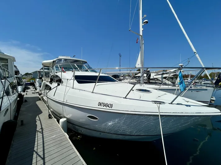  Yacht Photos Pics 2005 Cruisers Yachts 455 Express Motor Yacht docked at marina.