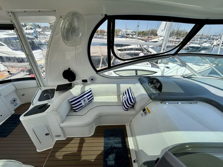  Yacht Photos Pics 2005 Cruisers Yachts 455 Express Motor Yacht interior with seating and nautical decor.