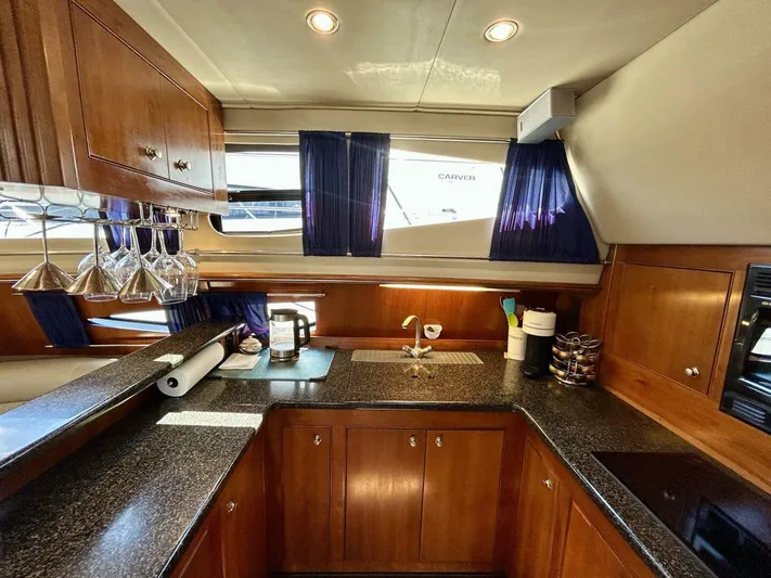  Yacht Photos Pics Luxurious kitchen interior of 2005 Cruisers Yachts 455 Express Motor Yacht.