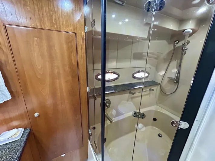  Yacht Photos Pics Luxurious bathroom in 2005 Cruisers Yachts 455 Express Motor Yacht with glass shower enclosure.