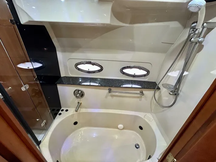  Yacht Photos Pics Luxurious bathroom in 2005 Cruisers Yachts 455 Express Motor Yacht with bathtub and shower.