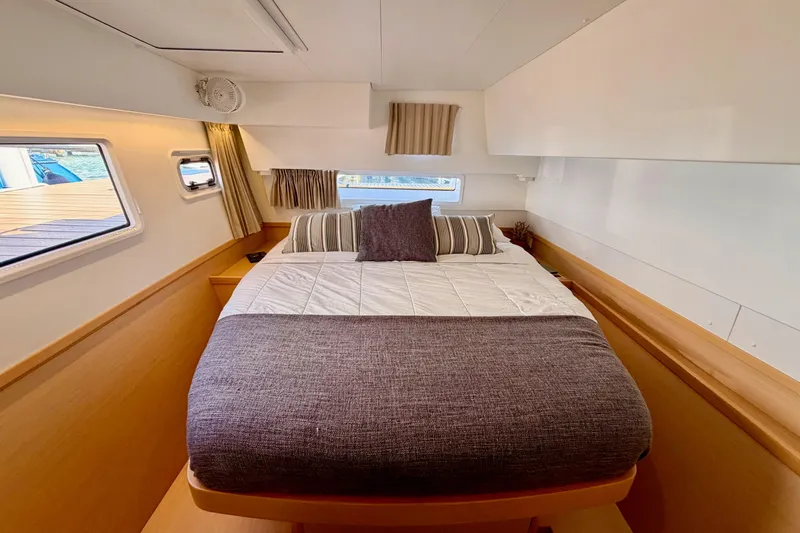 Island Hopp'r Owners Version Yacht Photos Pics Cozy bedroom interior of 2017 Lagoon 42 catamaran with modern design and natural light.