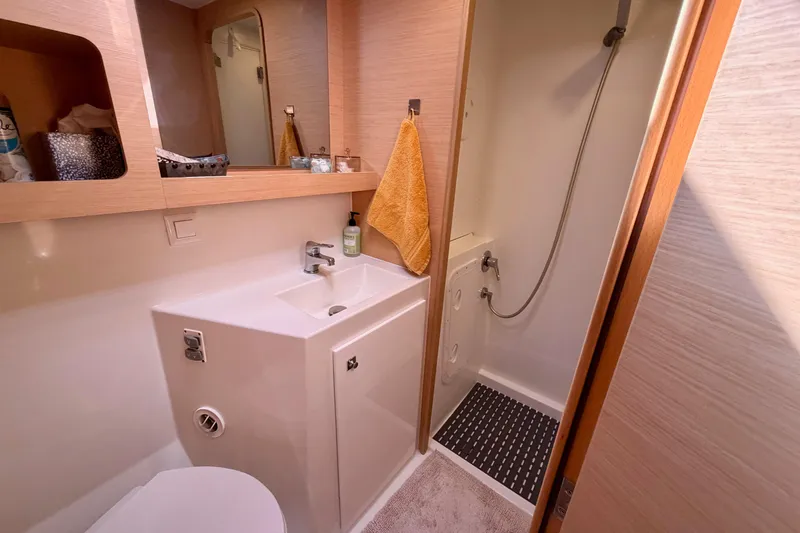 Island Hopp'r Owners Version Yacht Photos Pics Modern bathroom in 2017 Lagoon 42 yacht with shower, sink, and mirror.