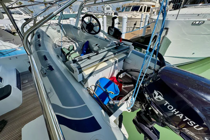 Island Hopp'r Owners Version Yacht Photos Pics 2017 Lagoon 42 boat with Tohatsu motor, docked at marina.