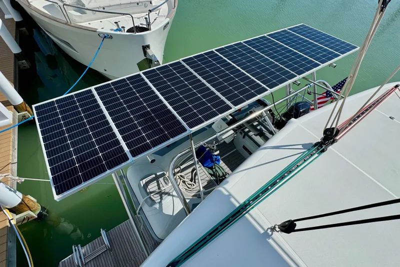 Island Hopp'r Owners Version Yacht Photos Pics 2017 Lagoon 42 catamaran with solar panels docked in marina.