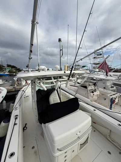 Loretta II Yacht Photos Pics Boston Whaler 320 Outrage 2012 at dock, cloudy sky.