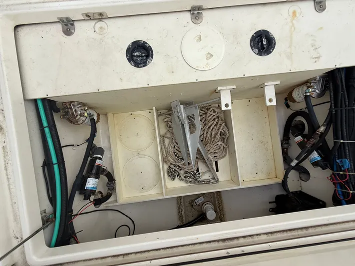 Loretta II Yacht Photos Pics Storage compartment in 2012 Boston Whaler 320 Outrage with anchor and ropes.
